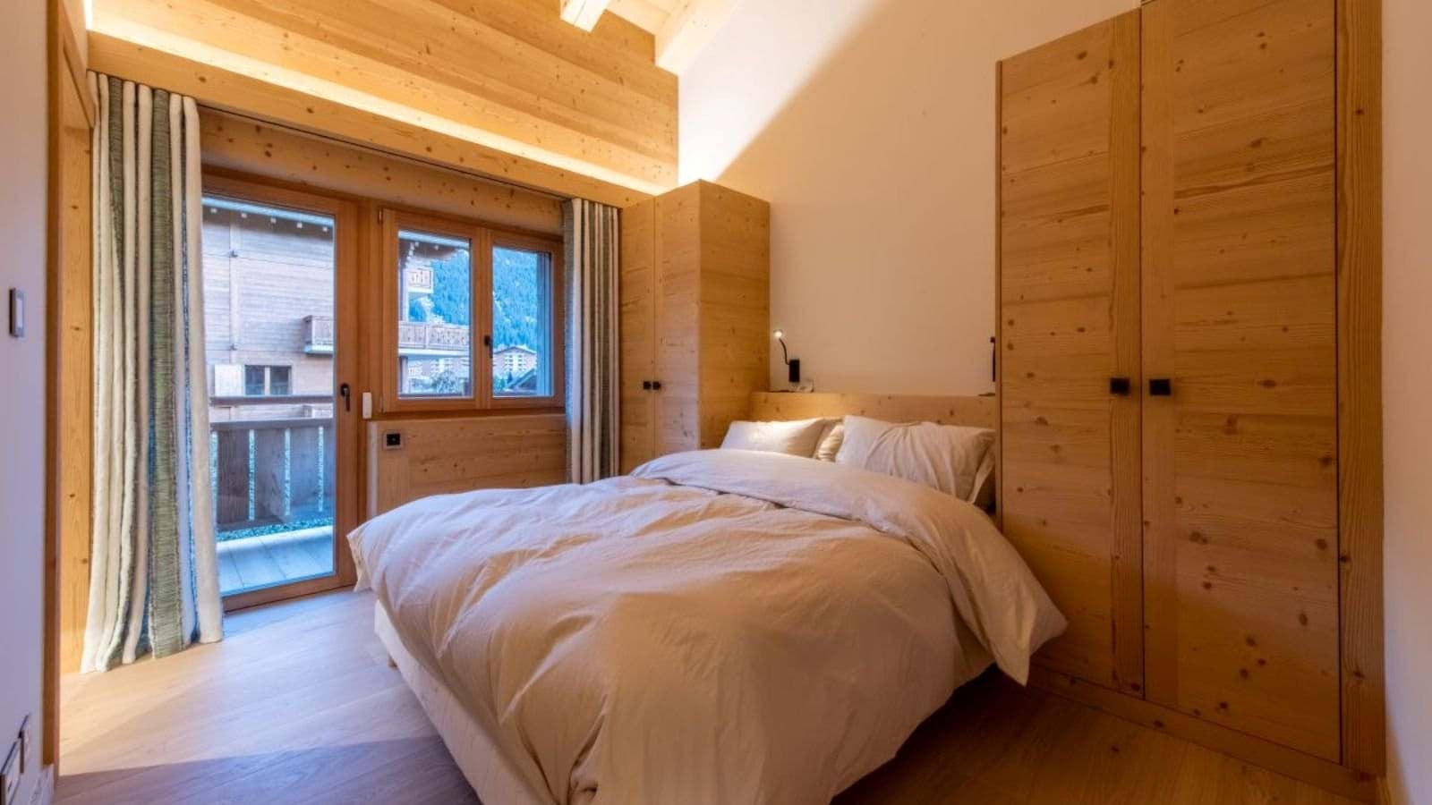 Guest bedroom with double bed and private balcony access