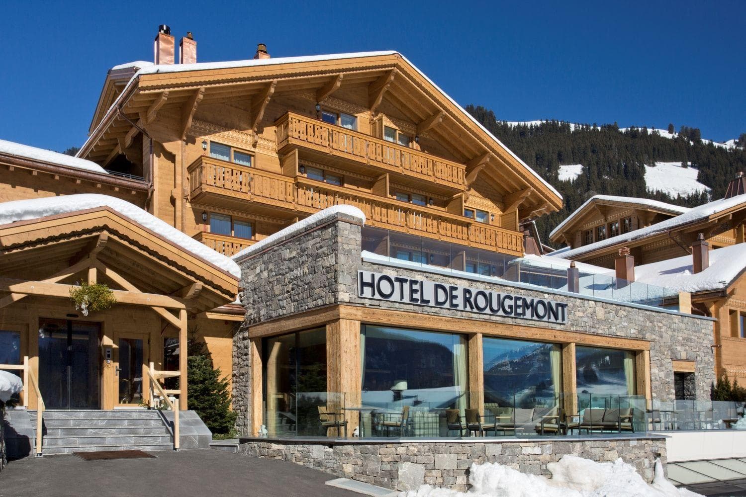 Chalet exterior with private balconies and ski slope access