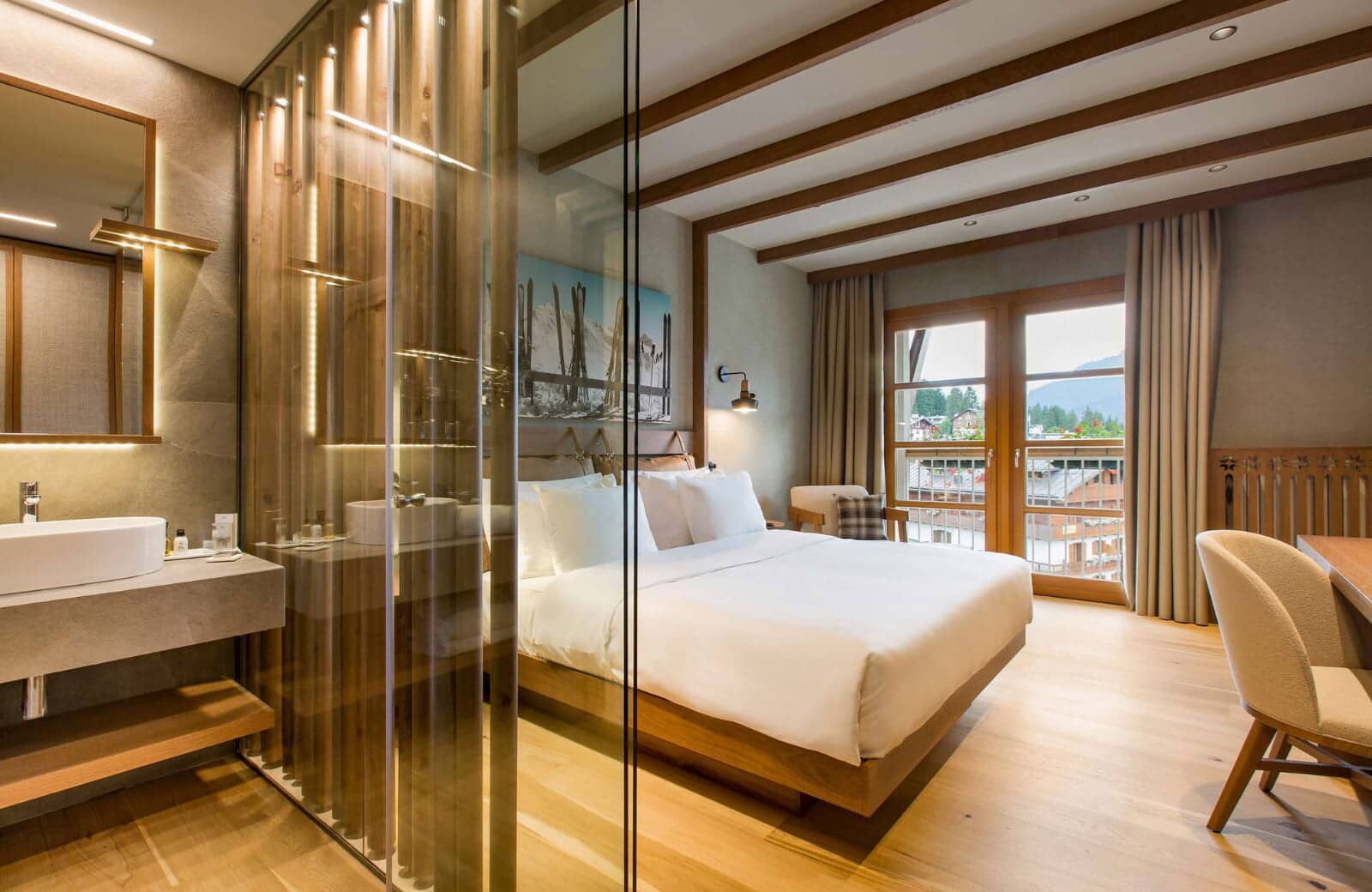 Primary suite with king bed and semi-open ensuite bathroom