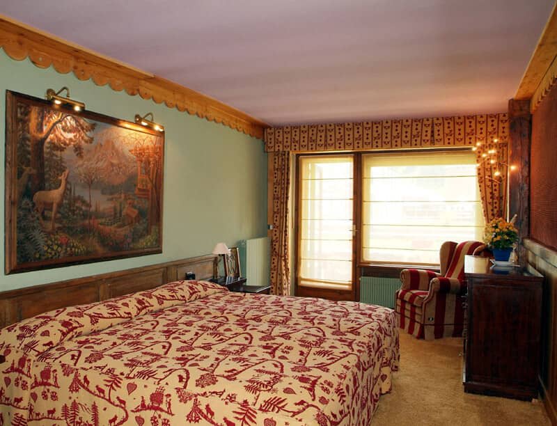 Guest bedroom with king bed and balcony access