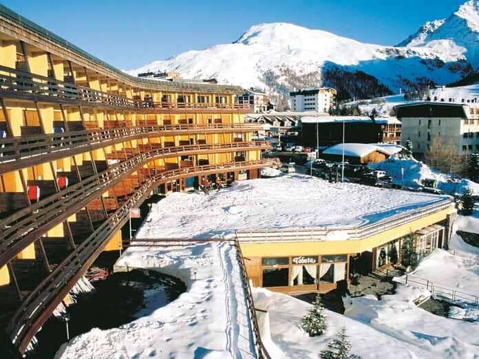 Ski-in/ski-out apartment complex with private balconies and mountain views