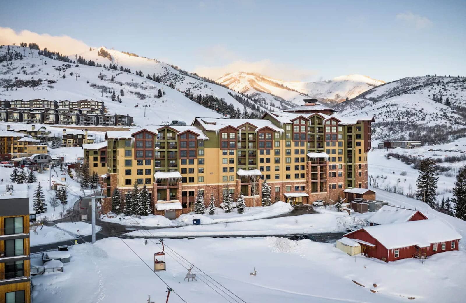 Ski-in/ski-out lodge exterior with direct access to gondola and mountain trails