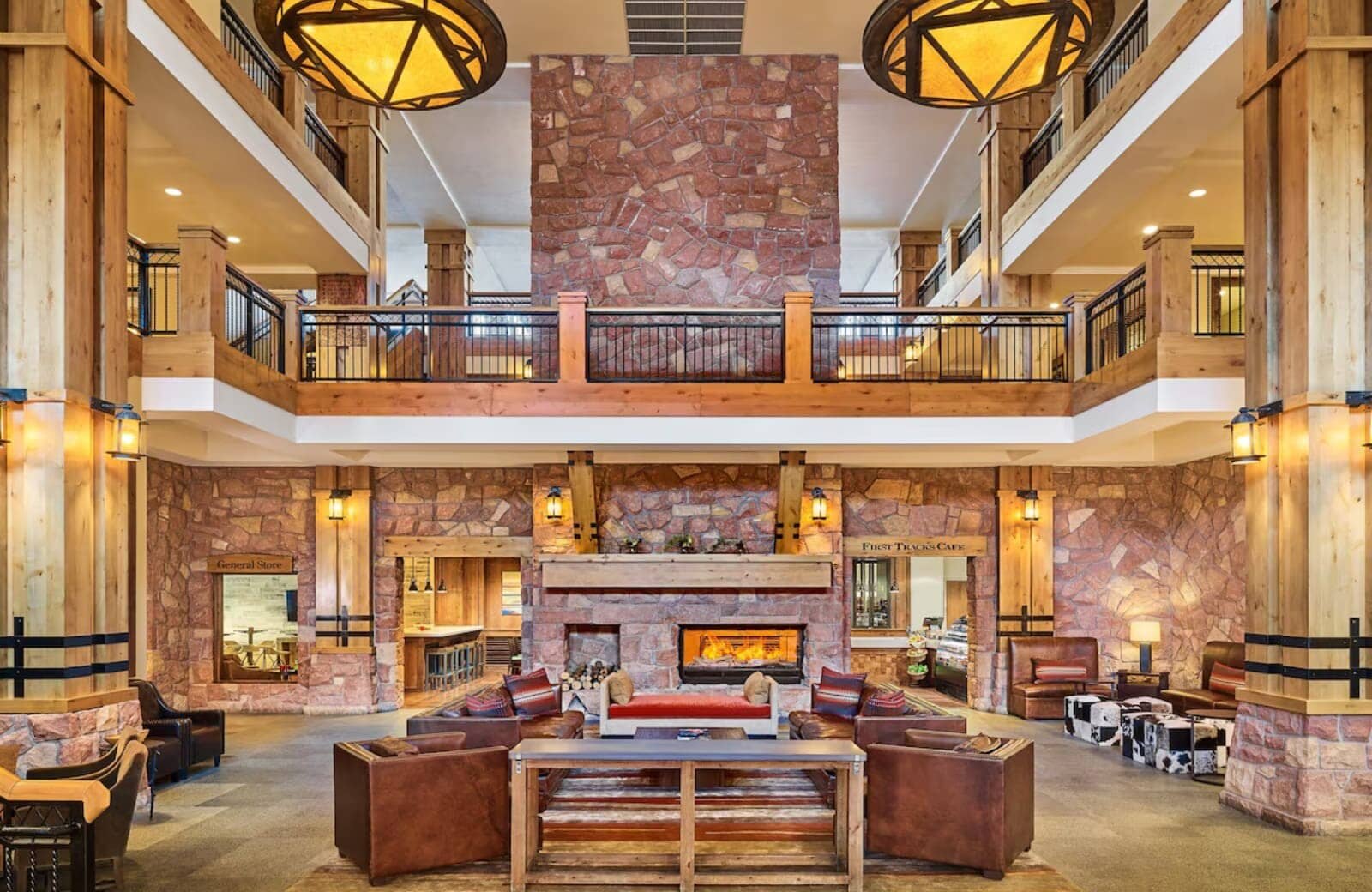 Lobby lounge with floor-to-ceiling stone fireplace and on-site cafe access