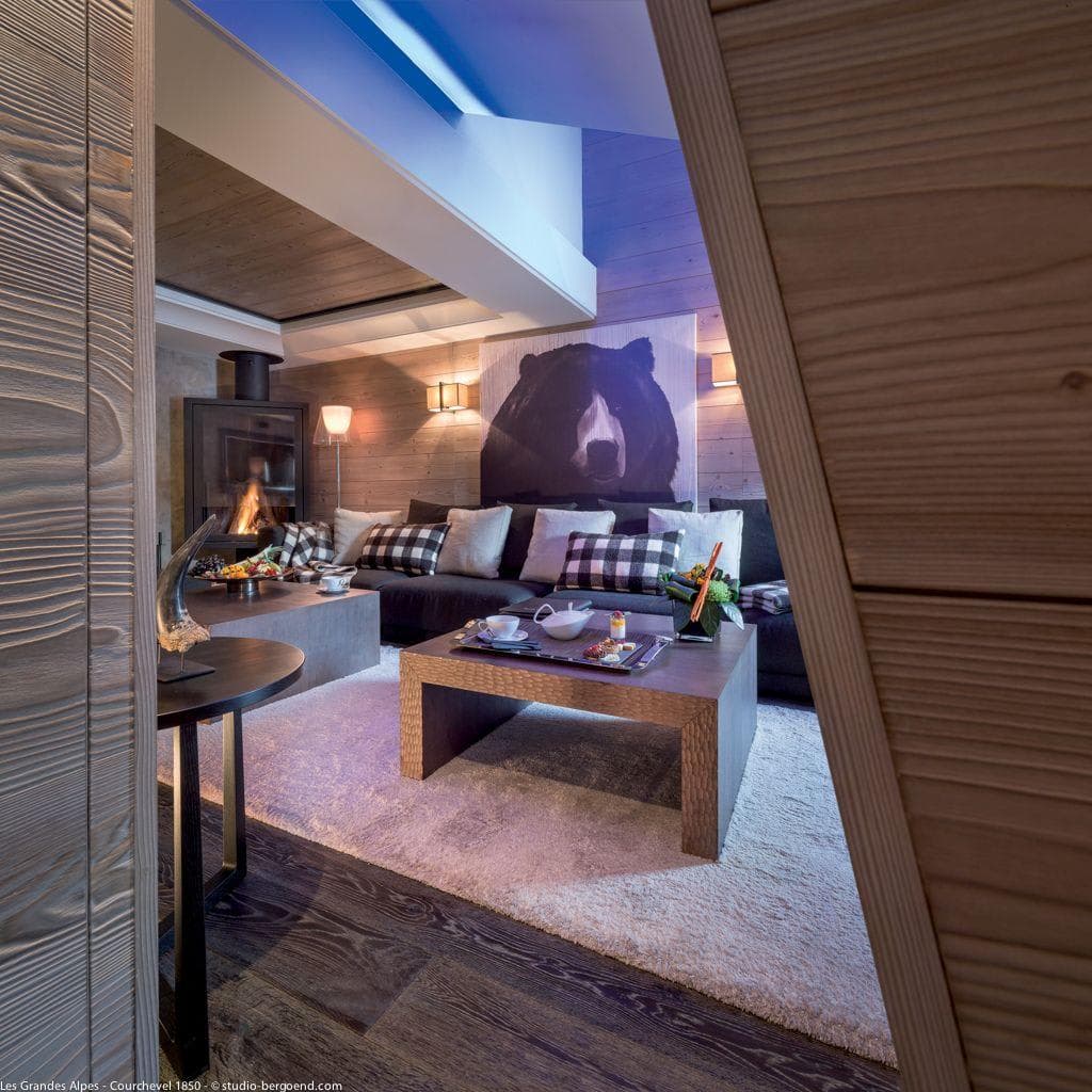 Living area with wood-burning fireplace and sectional seating