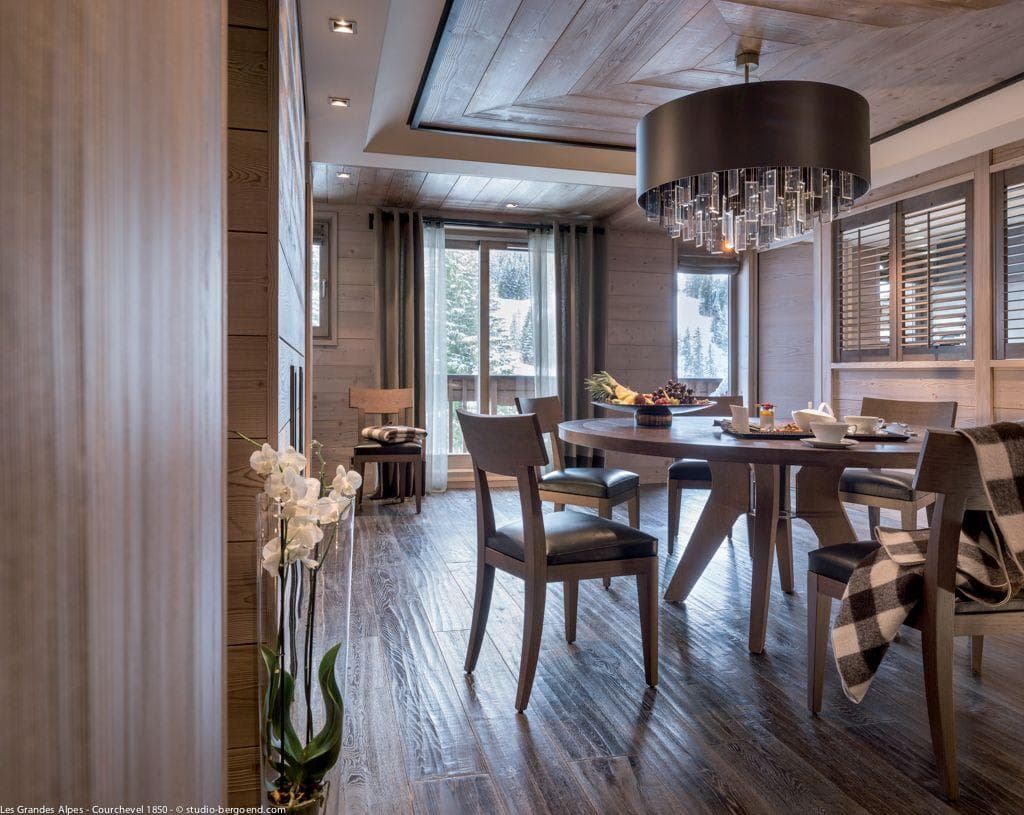 Dining area with seating for 6 and mountain views through terrace doors