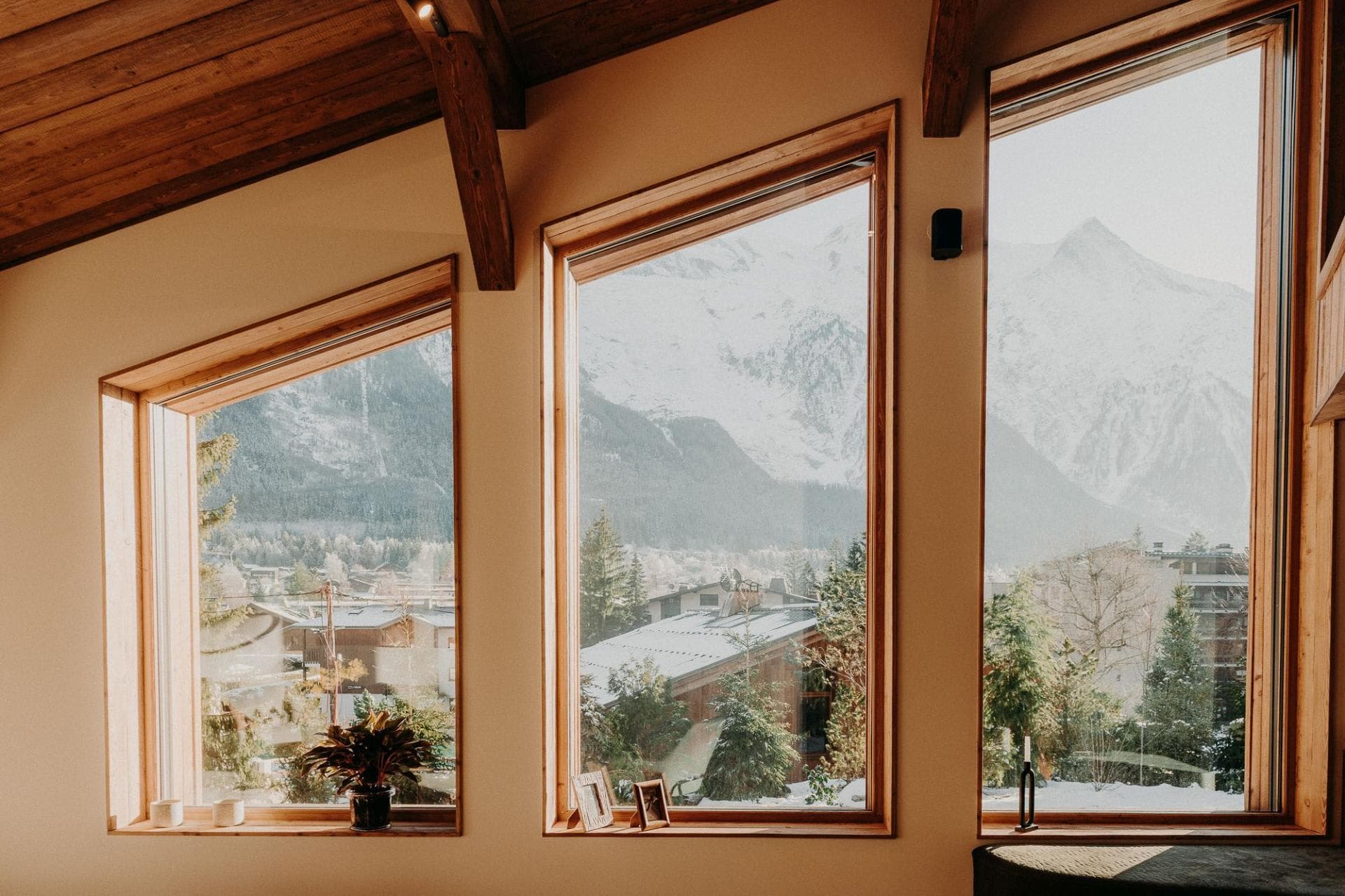 Floor-to-ceiling windows with panoramic views of the French Alps