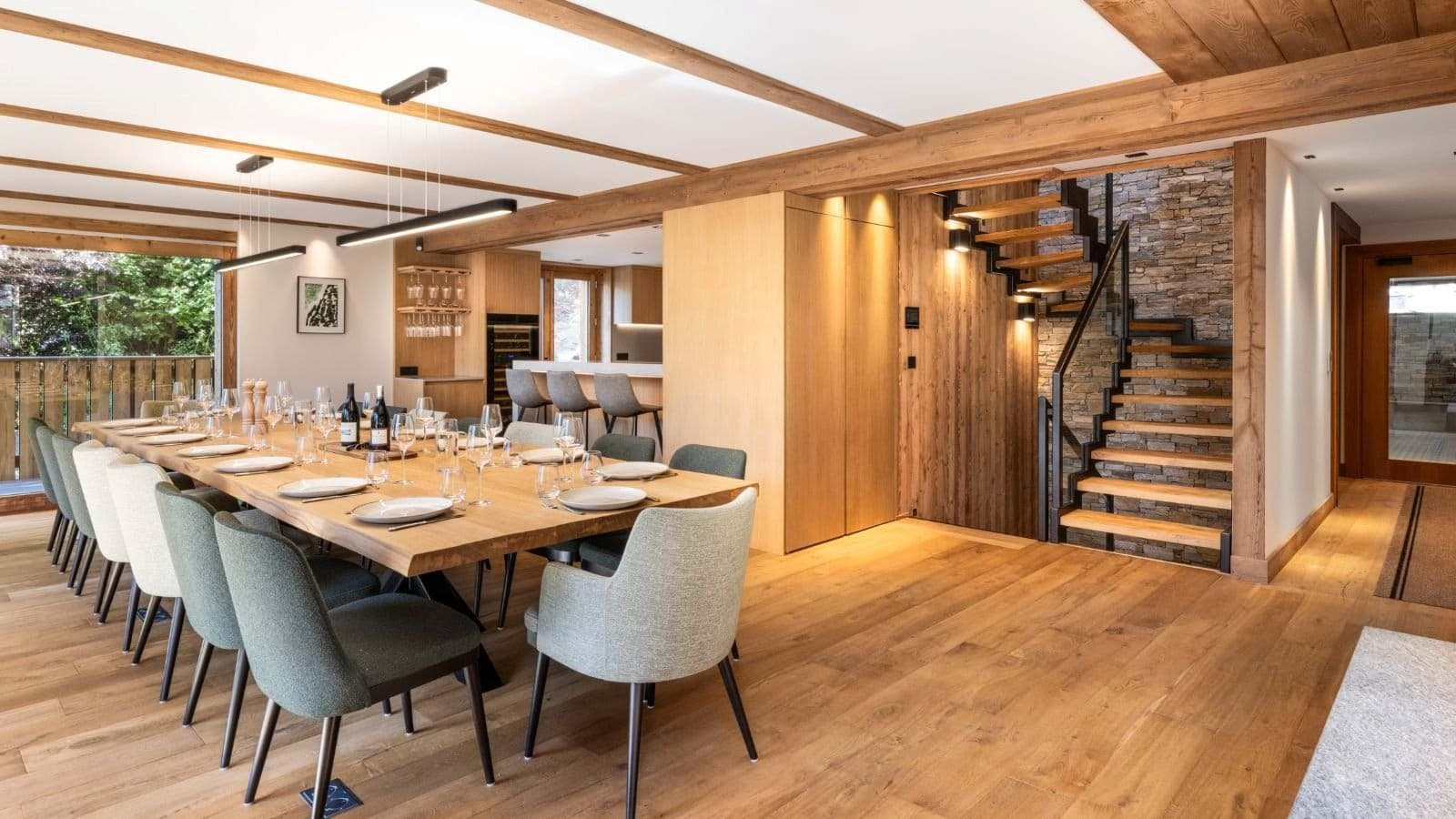 Dining area seats 12; adjacent kitchen with wine fridge and breakfast bar