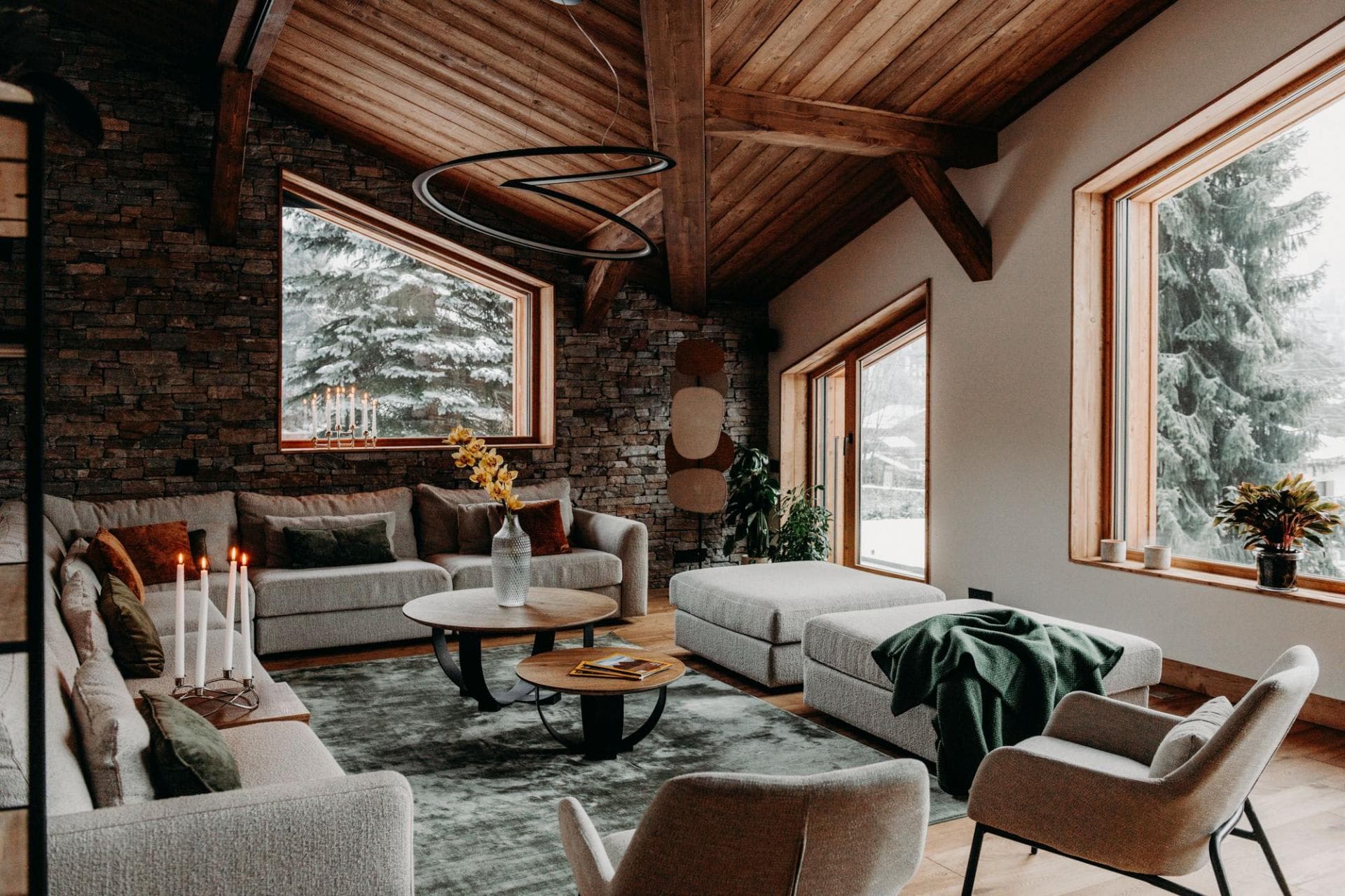 Living room with sectional seating for 8 and vaulted wood ceilings