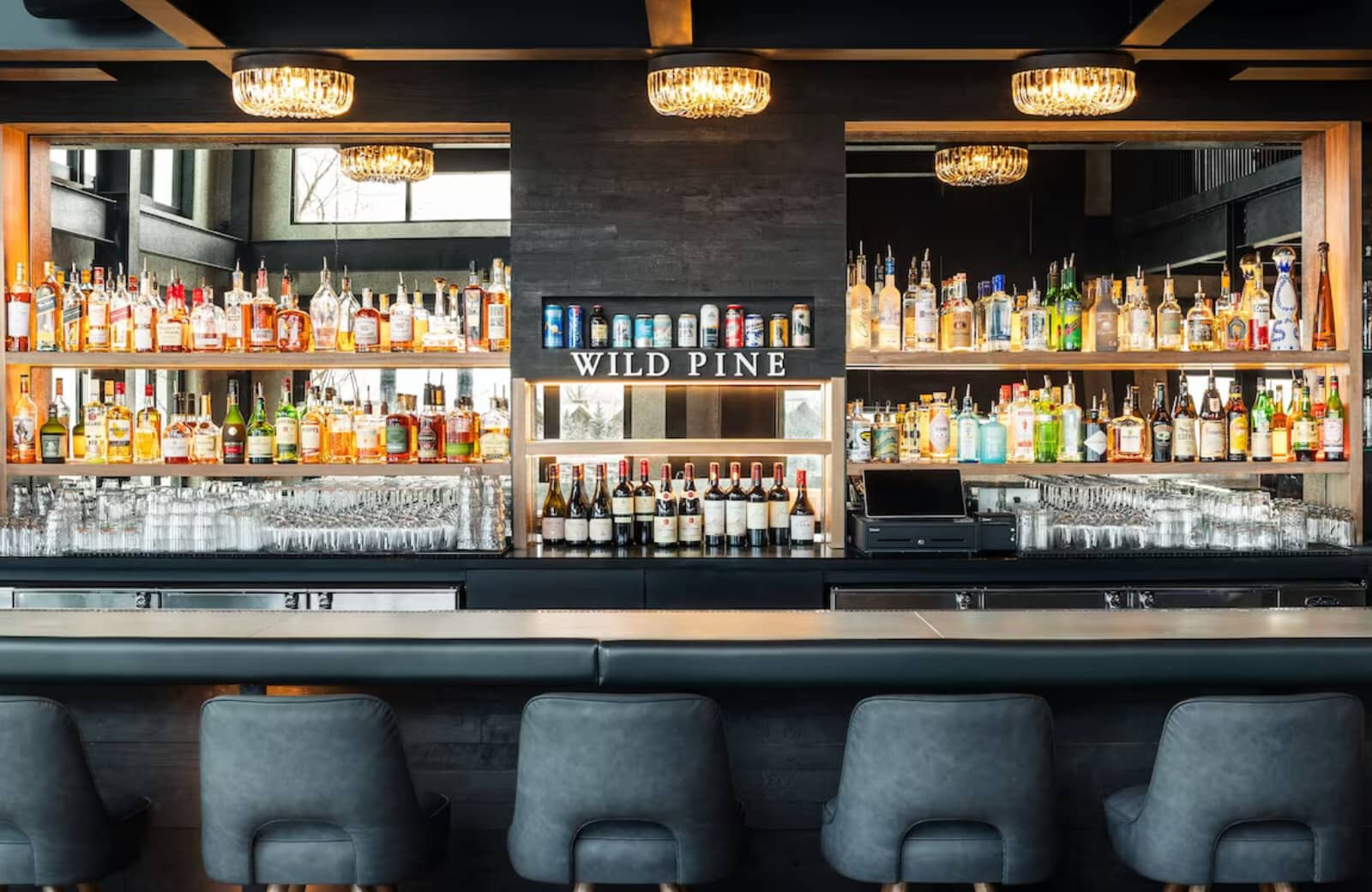 Wild Pine bar with padded seating and fully stocked liquor selection