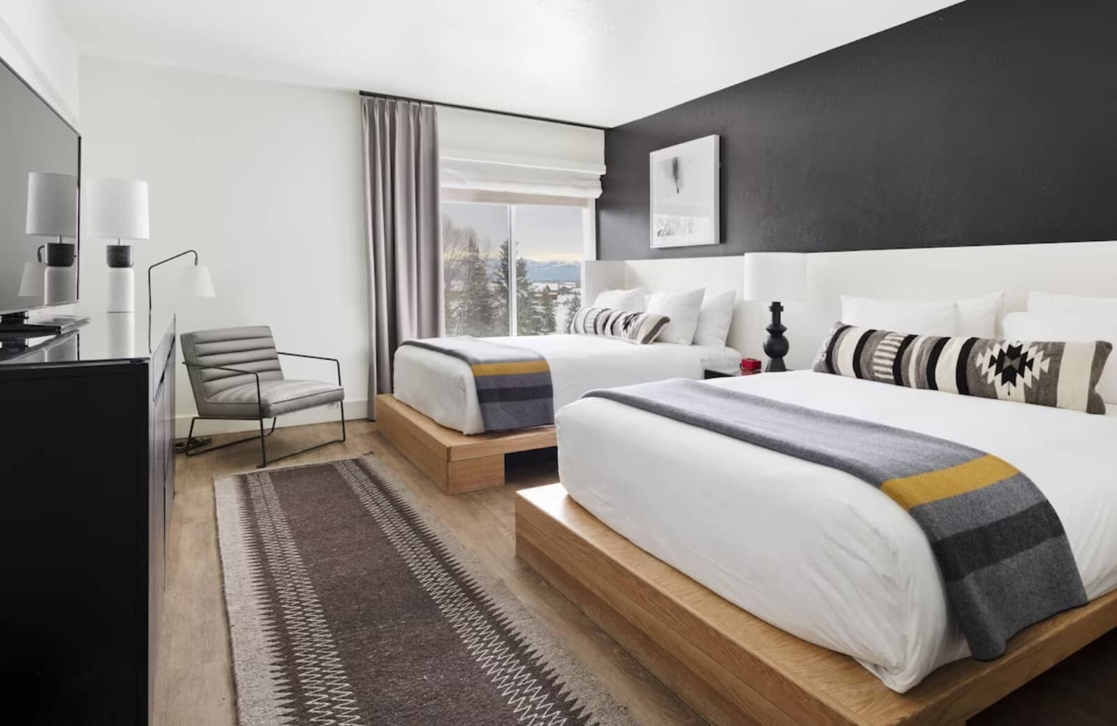 Guest bedroom with two queen beds and mountain views