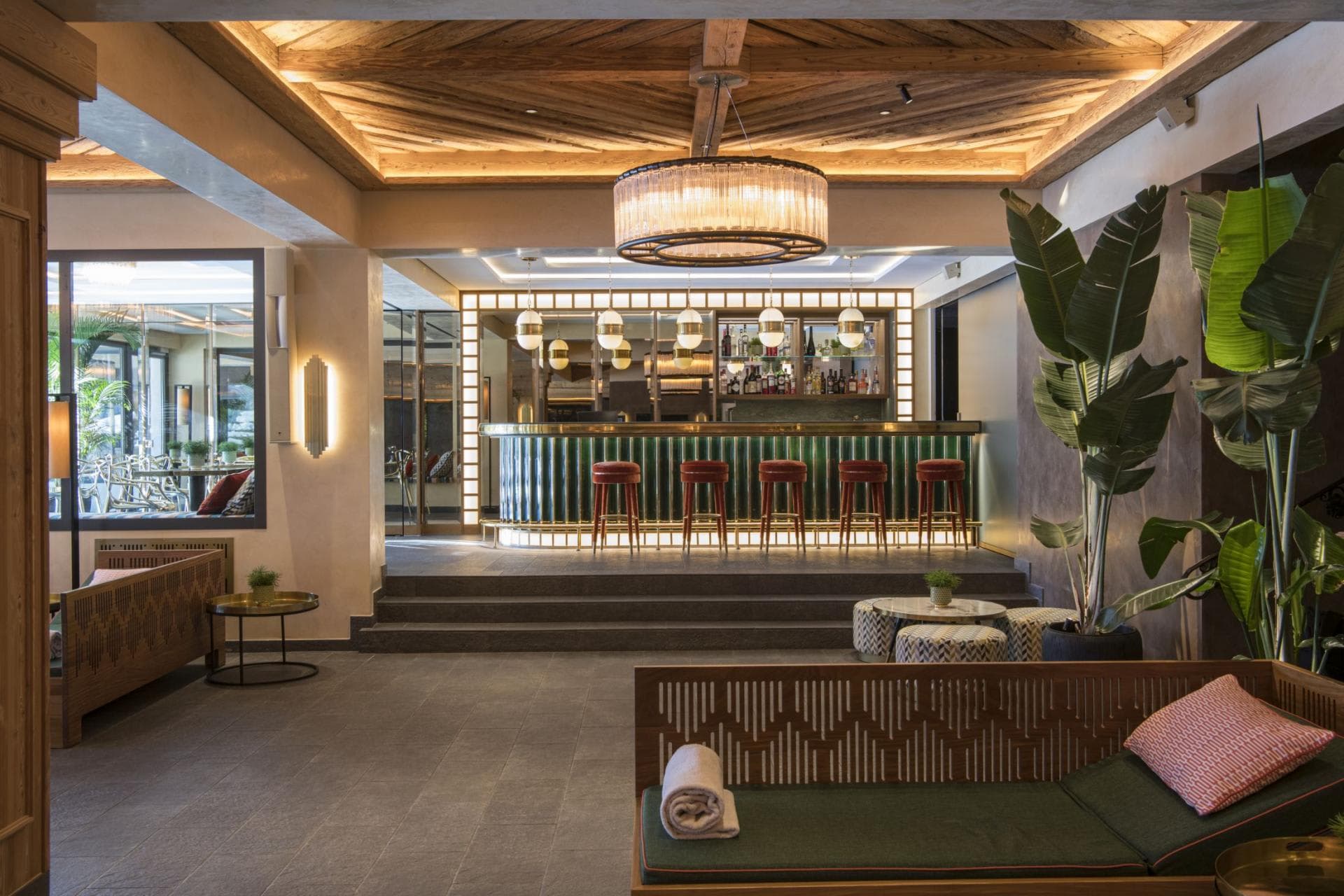 Lounge and cocktail bar with upholstered daybeds and five-stool counter service