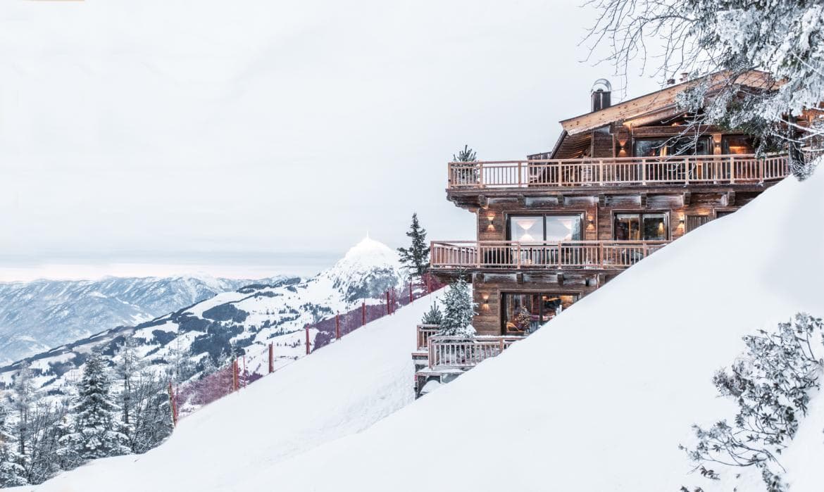 Ski-in, ski-out timber chalet with private balconies and valley views