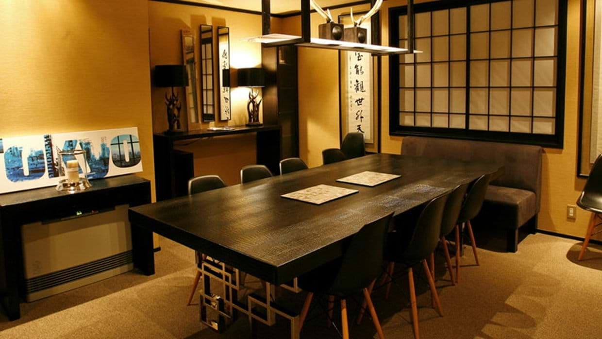 Private dining room seats 8; shoji screen windows and Japanese calligraphy art
