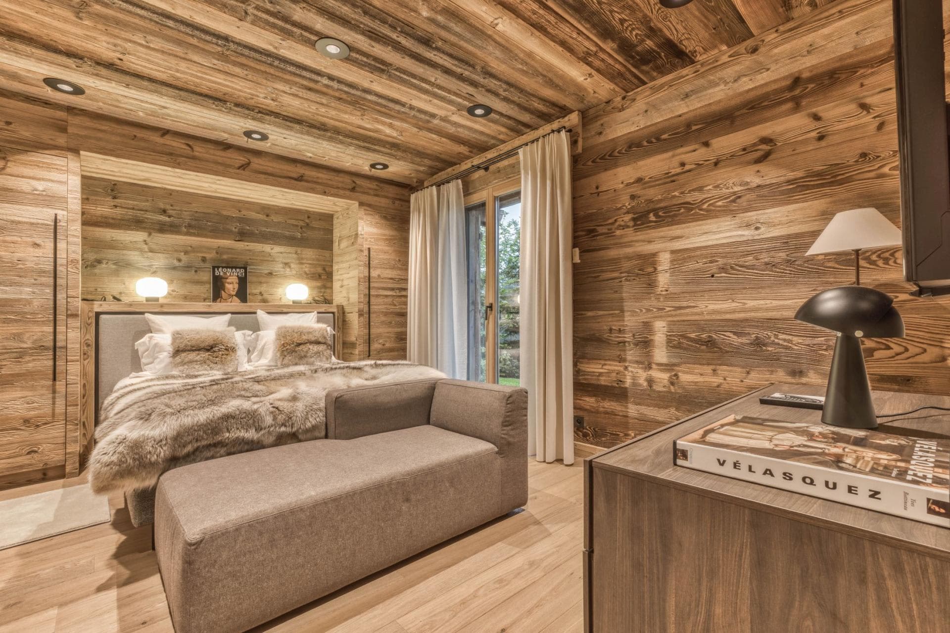 Guest bedroom with queen bed and garden access through sliding doors