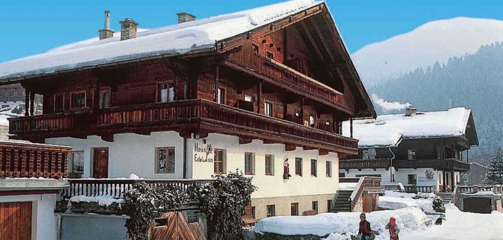Traditional Alpine chalet with wrap-around balconies and mountain views