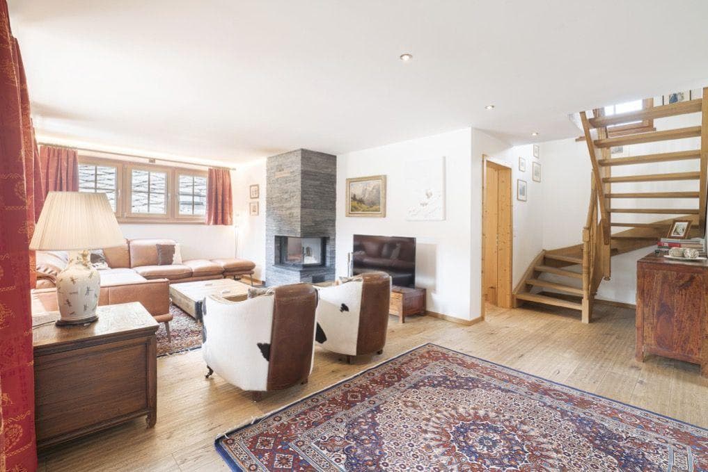 Living room with corner fireplace and sectional seating for 6