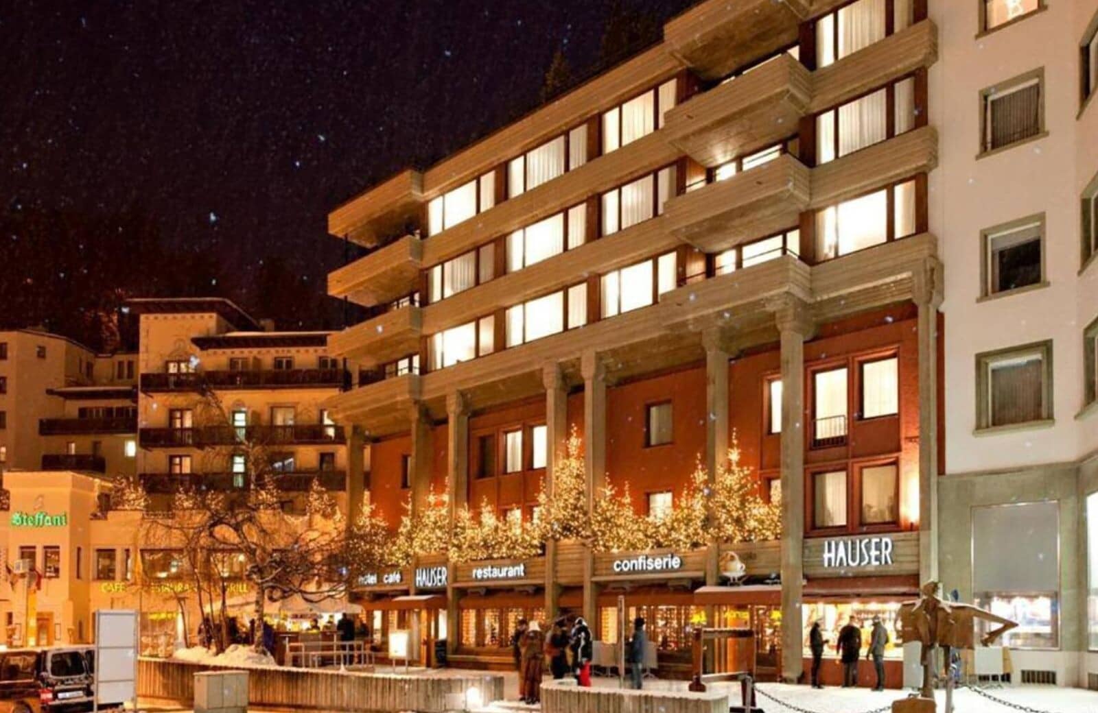 Building exterior at night; street-level access to on-site restaurant and confiserie