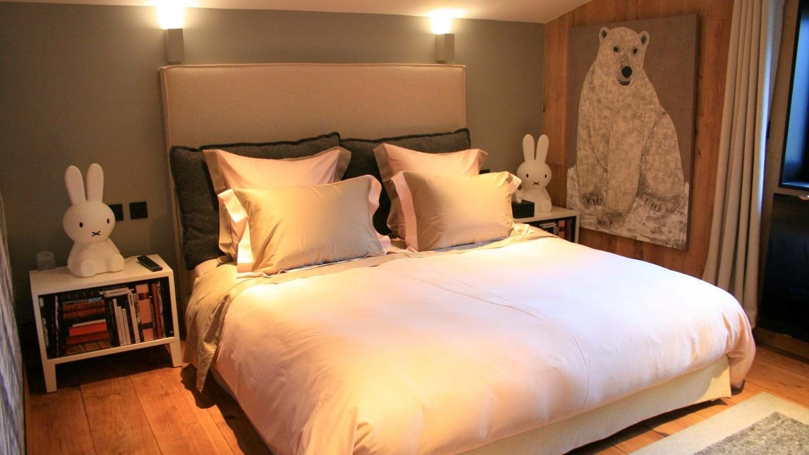 Guest bedroom with king bed and reading lamps