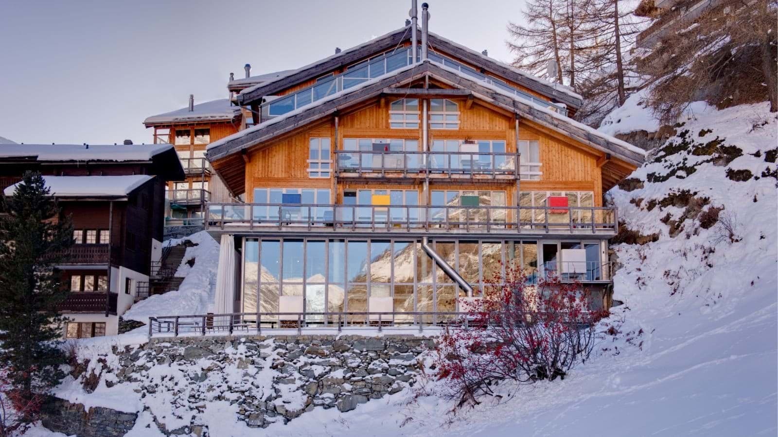 Ski-in/ski-out timber chalet with glass-enclosed lower terrace
