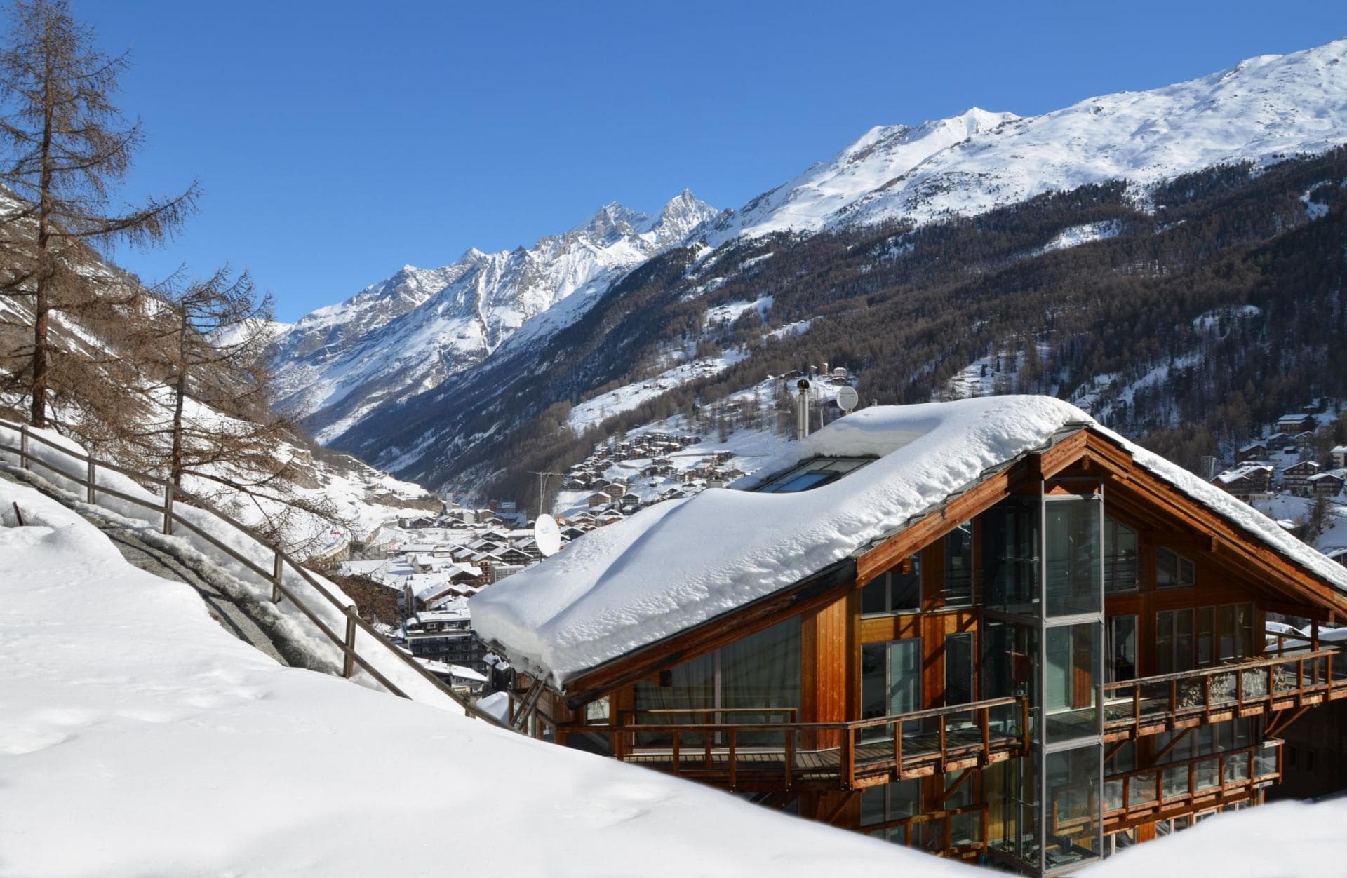 Chalet exterior with mountain views and private glass elevator