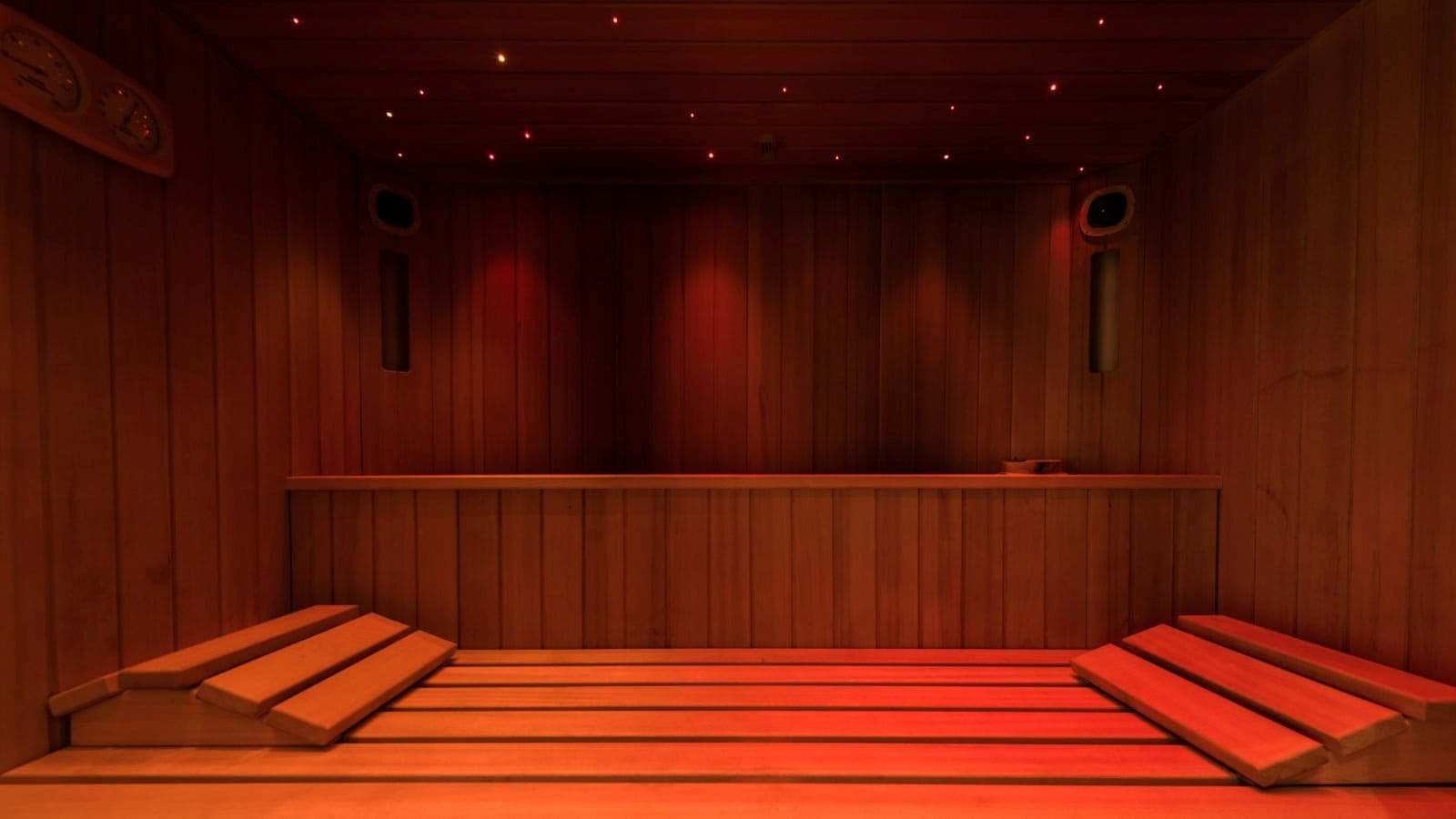Private sauna with starlight ceiling and wooden headrests