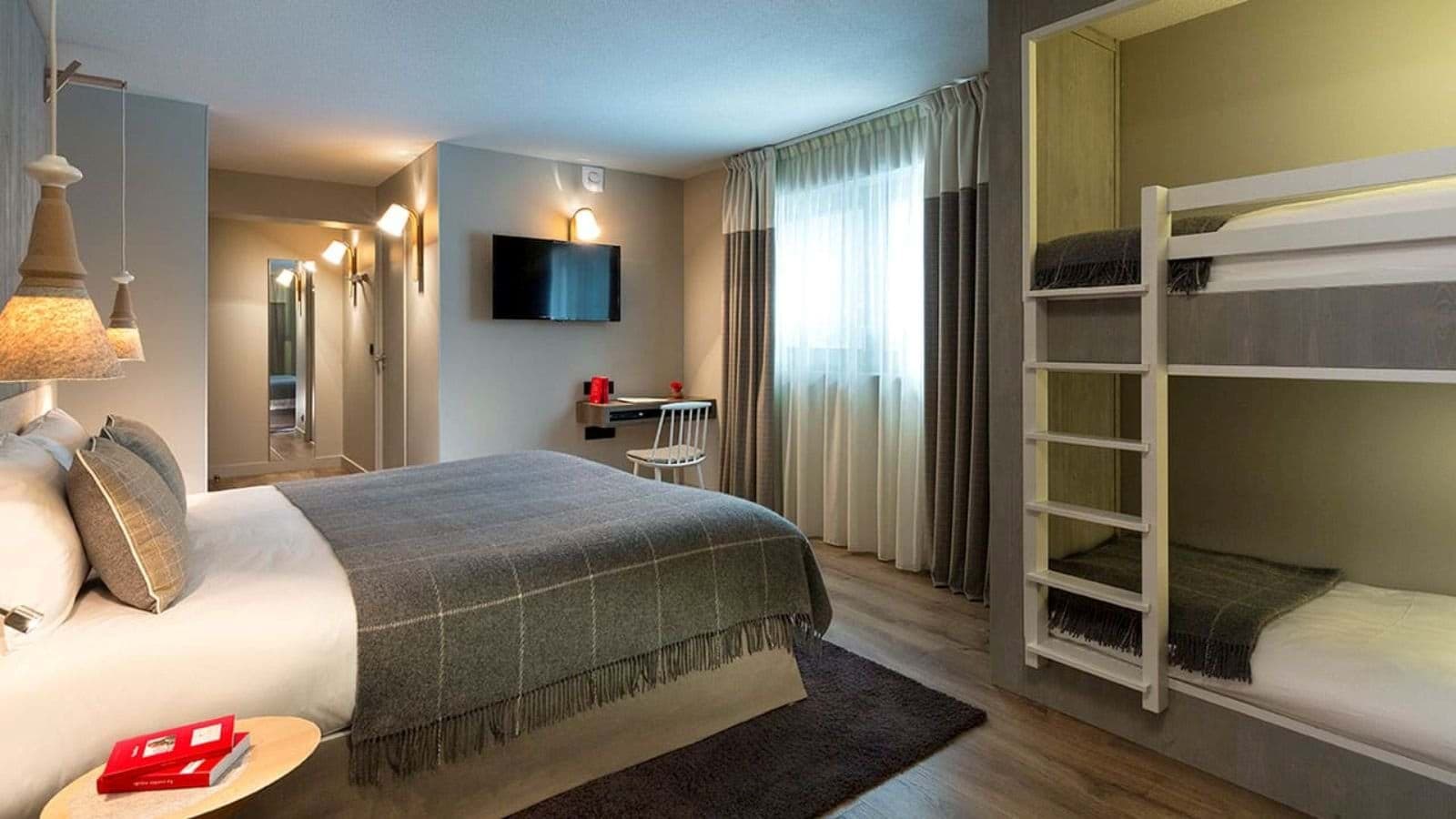 Family bedroom with king bed, built-in twin bunks, and work desk