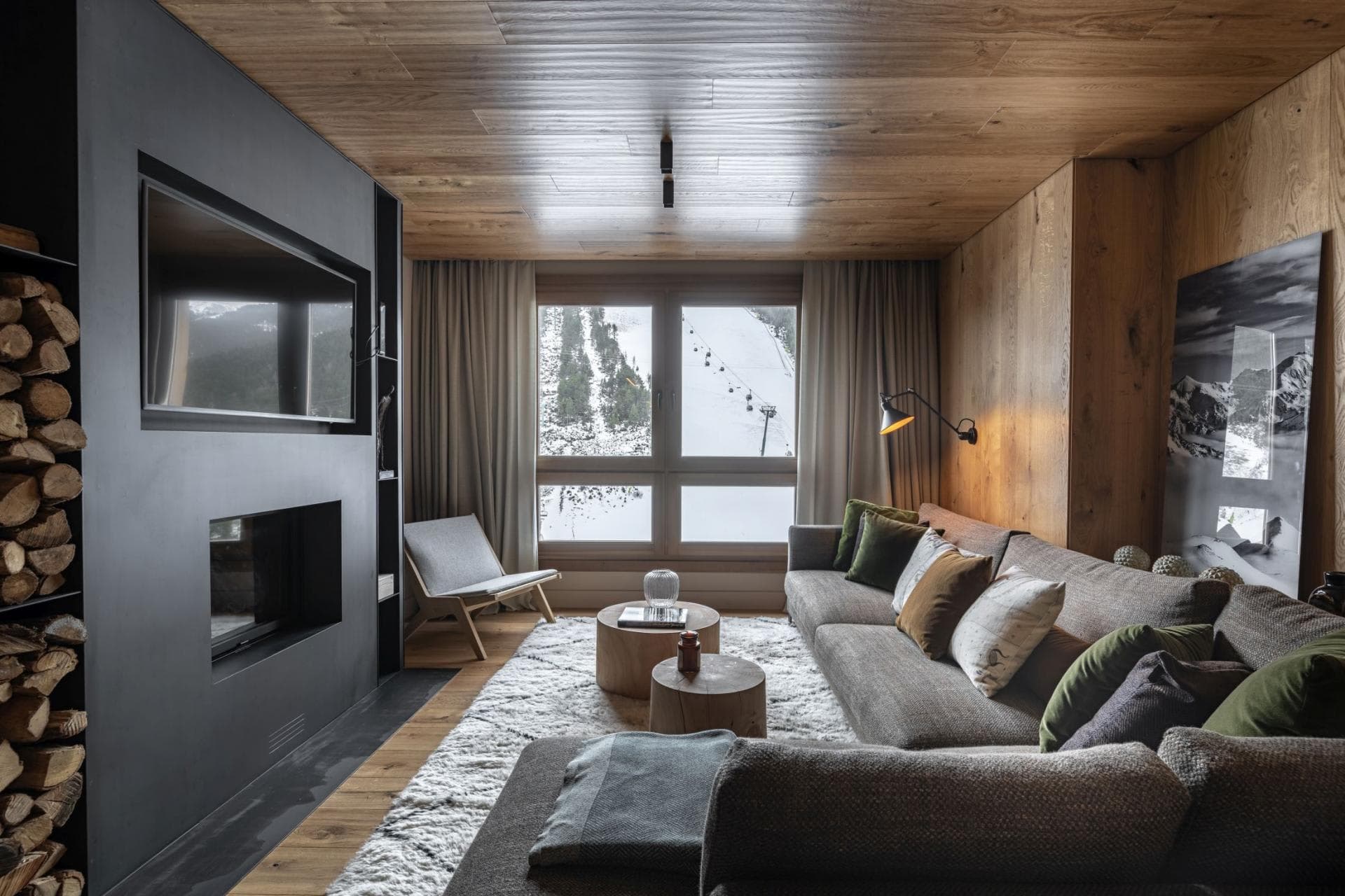 Living area with wood-burning fireplace and ski lift views