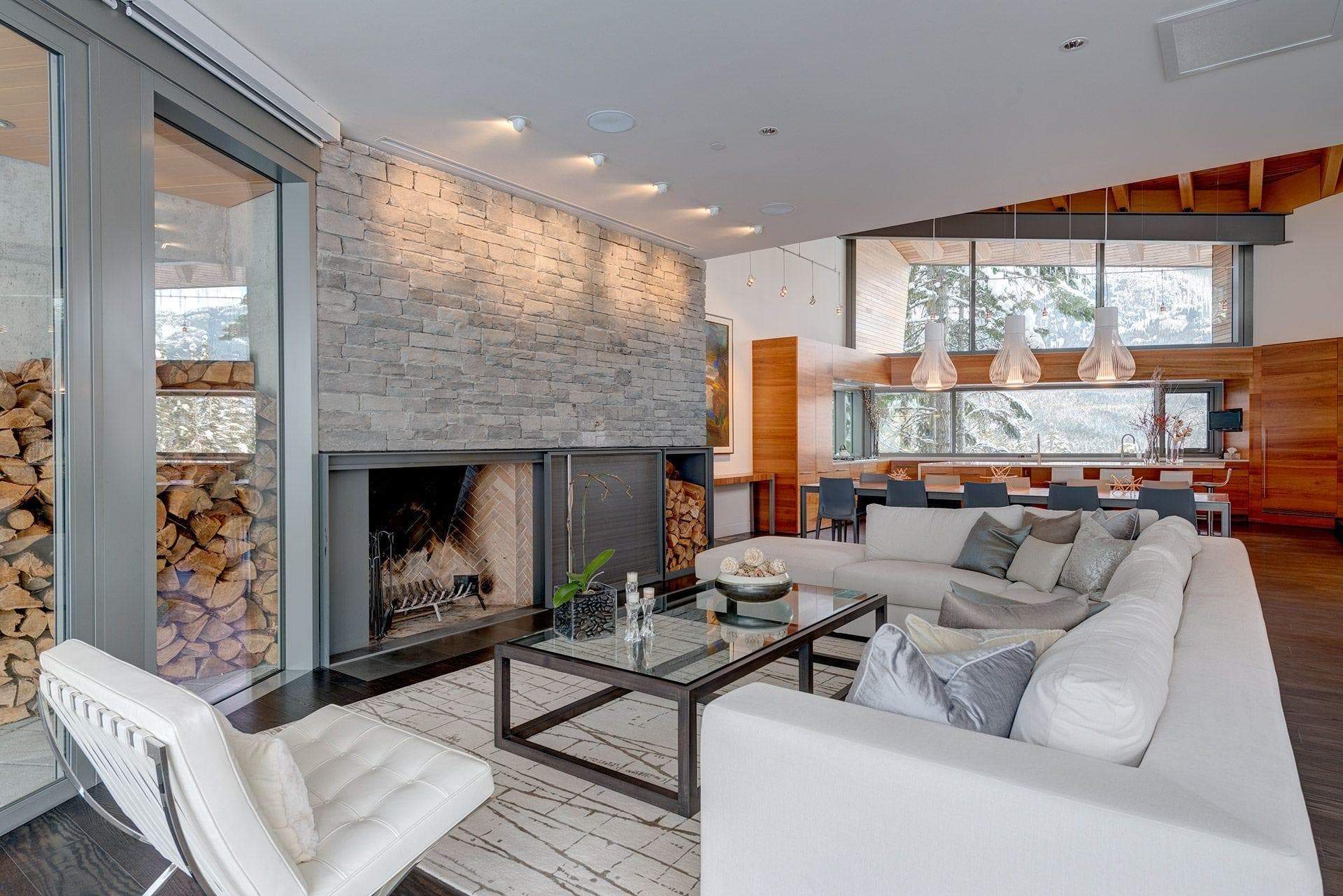 Living area with wood-burning fireplace and sectional seating for 8