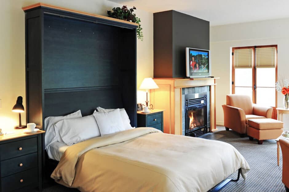 Studio living area with queen Murphy bed and gas fireplace