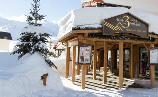 Ski-in entry and hotel terrace with mountain views