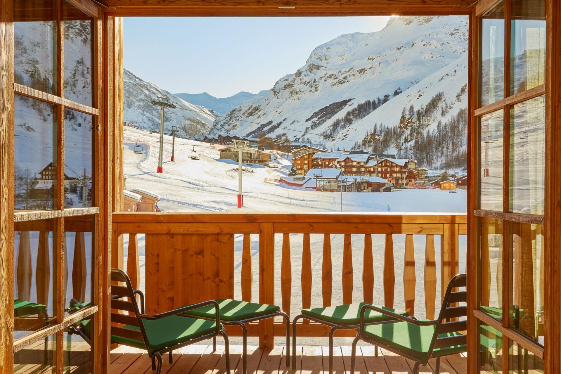 Private balcony with lounge seating and direct ski-in/ski-out mountain views