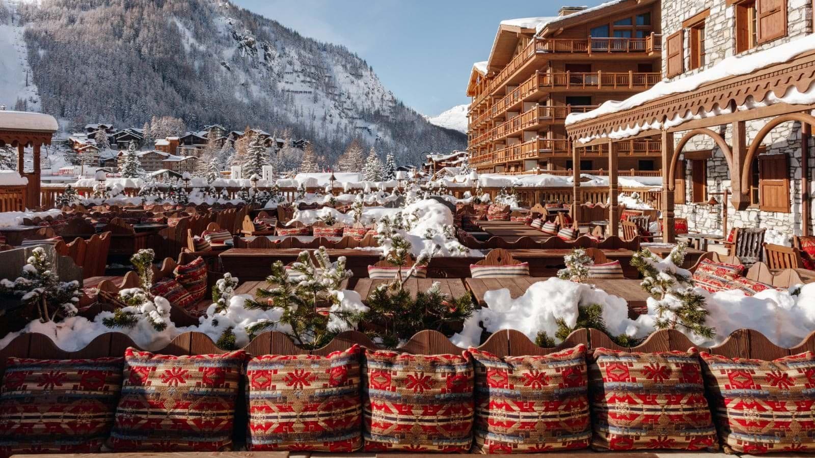 Shared outdoor terrace with heated seating and Val d'Isère mountain views