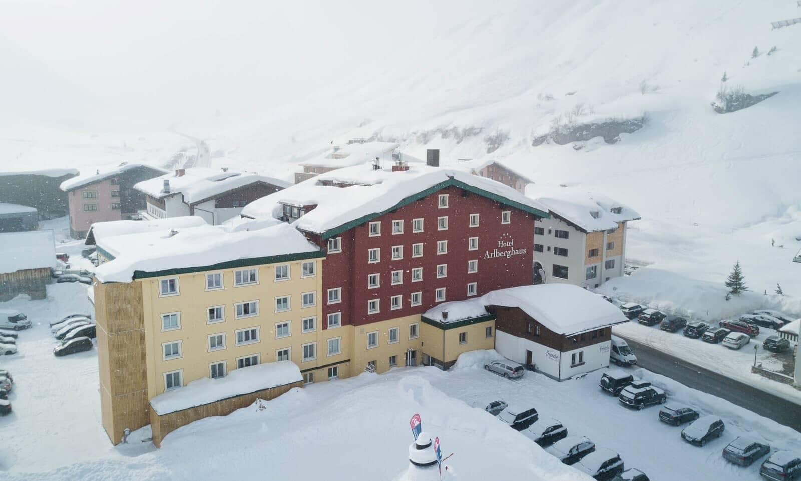 Ski-in/ski-out hotel exterior with on-site parking and mountain views