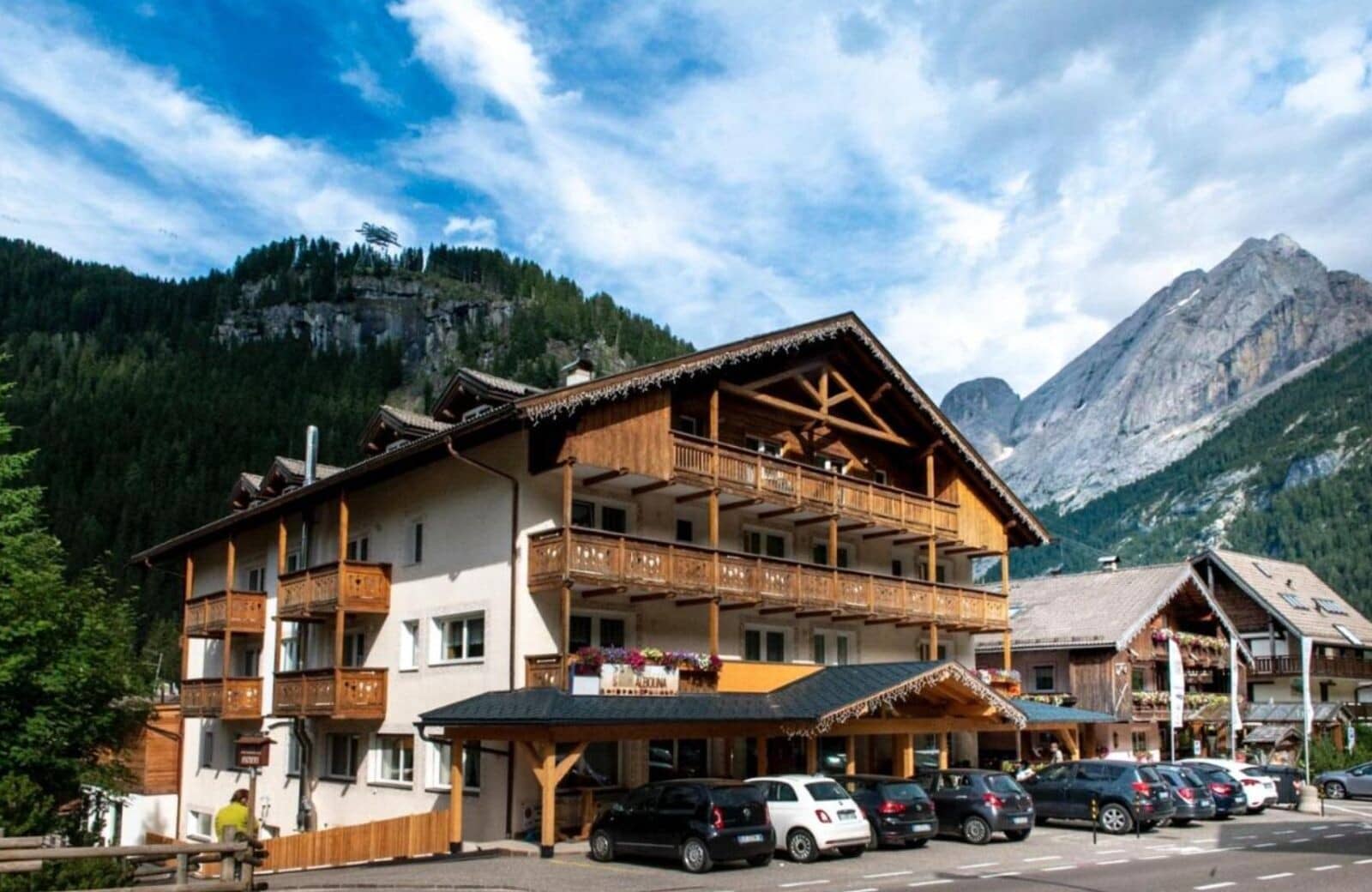 Chalet exterior with private wooden balconies and on-site parking