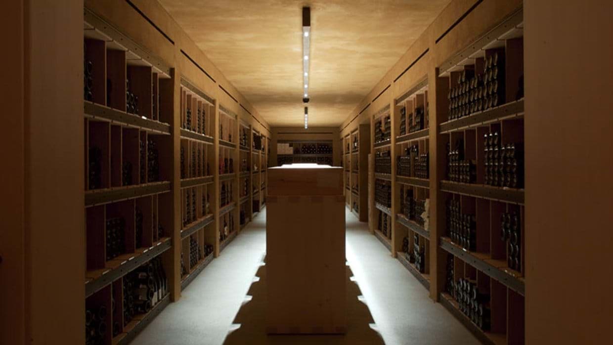 Wine cellar with floor-to-ceiling racks and central island