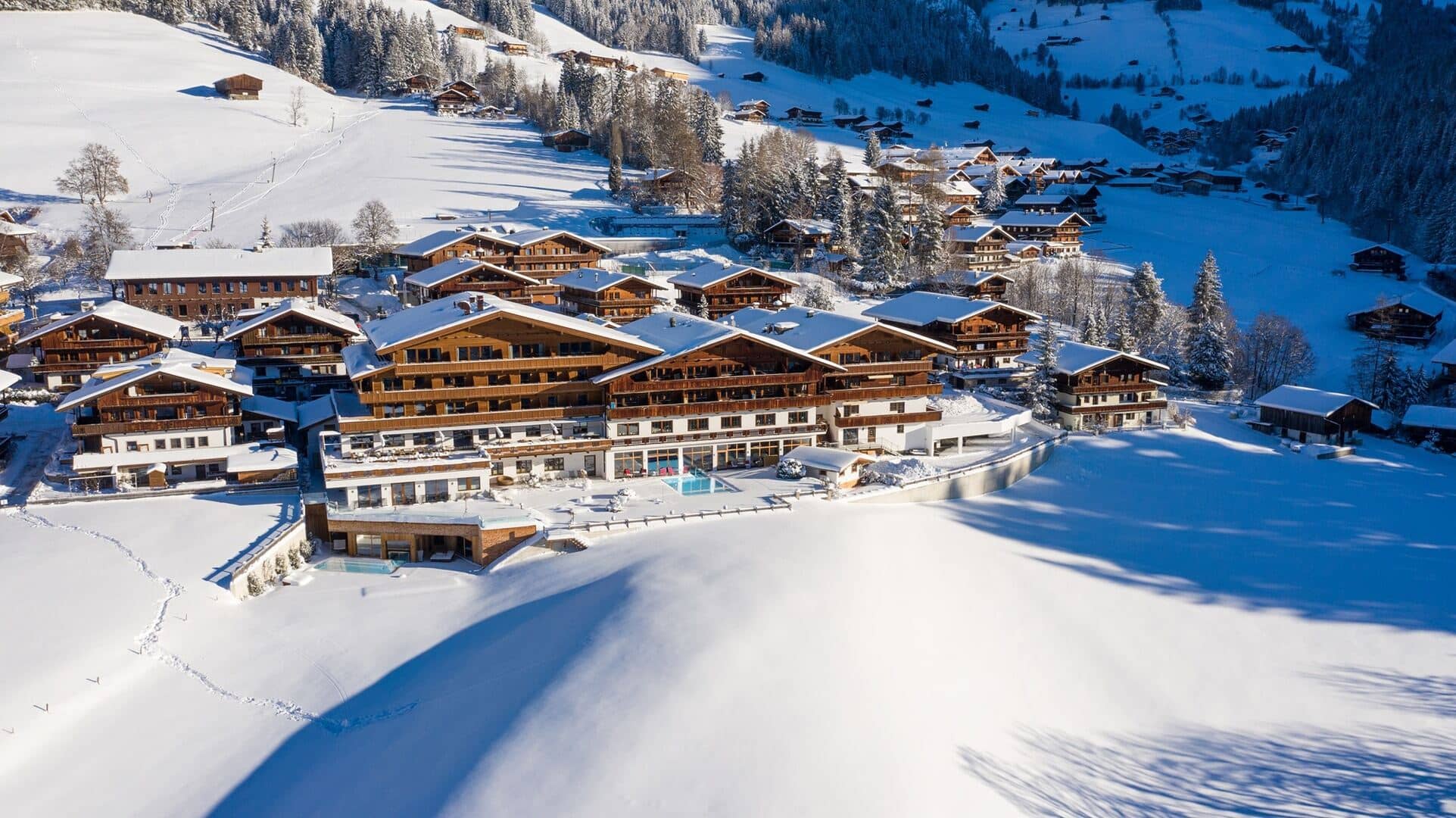 Ski-in, ski-out resort with outdoor heated pool and mountain views