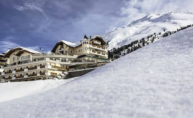 Ski-in/ski-out chalet exterior with immediate access to mountain slopes