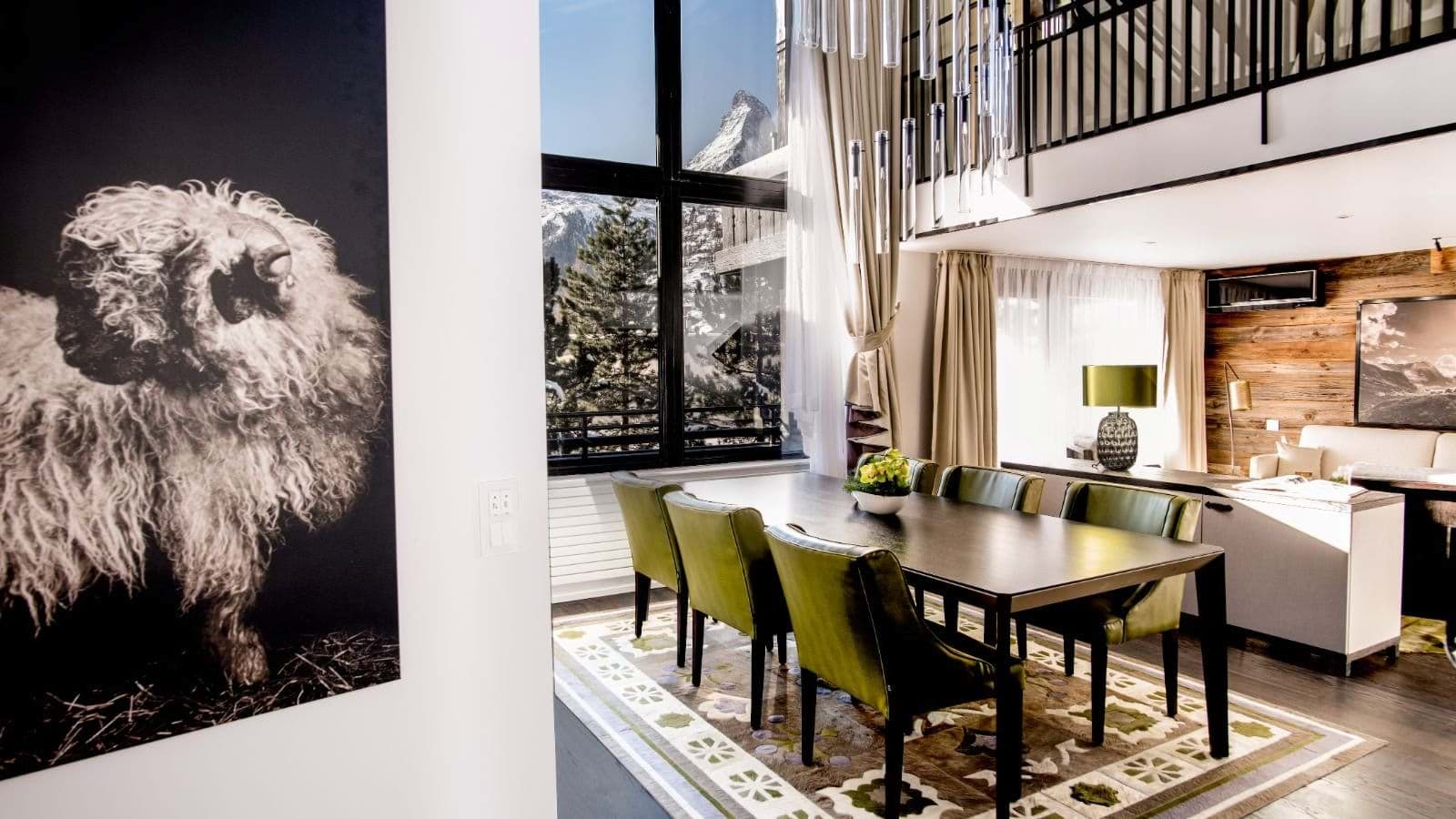 Dining area seats 8; floor-to-ceiling windows with Matterhorn views