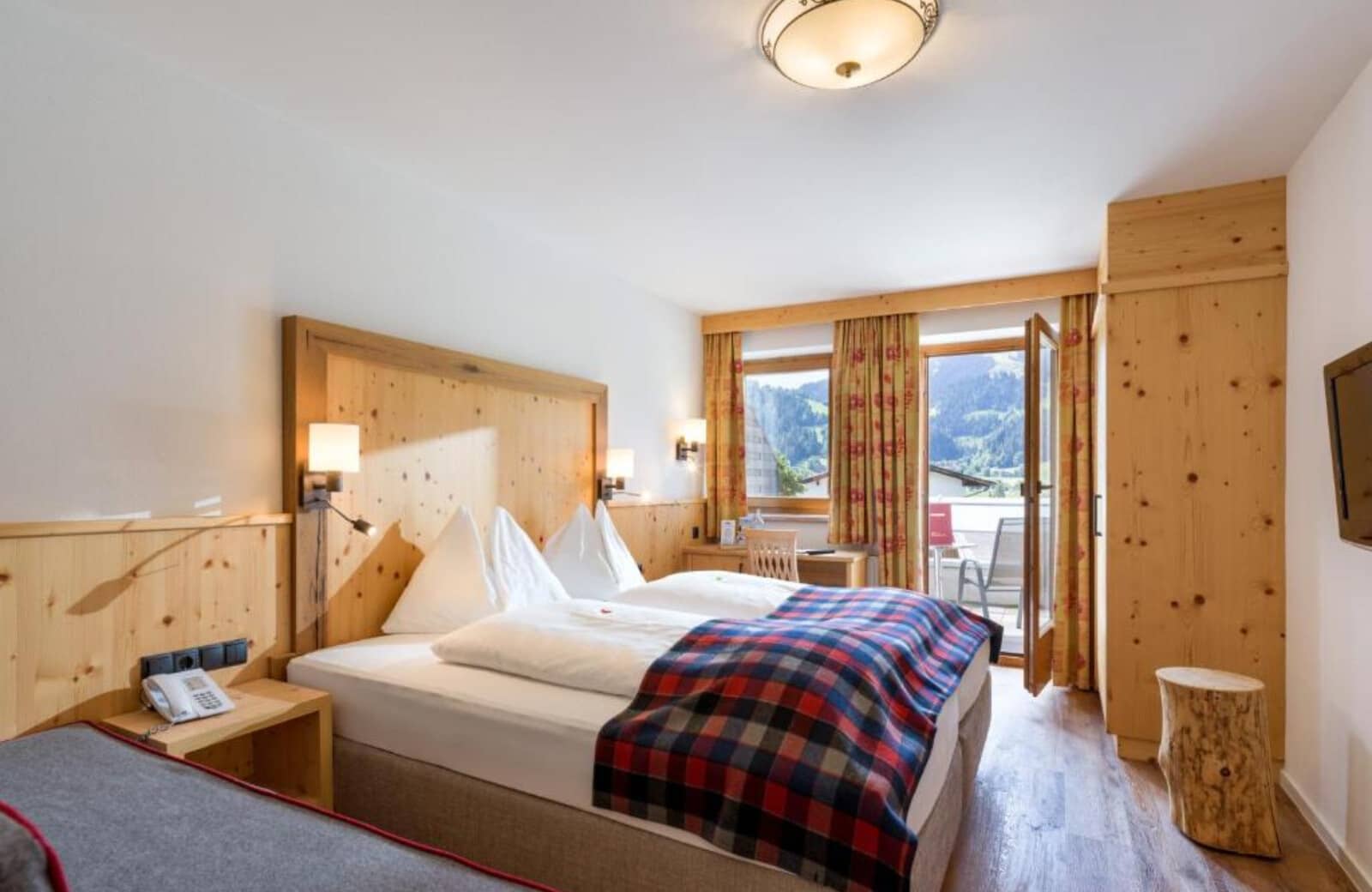 Guest bedroom with twin beds and private balcony access