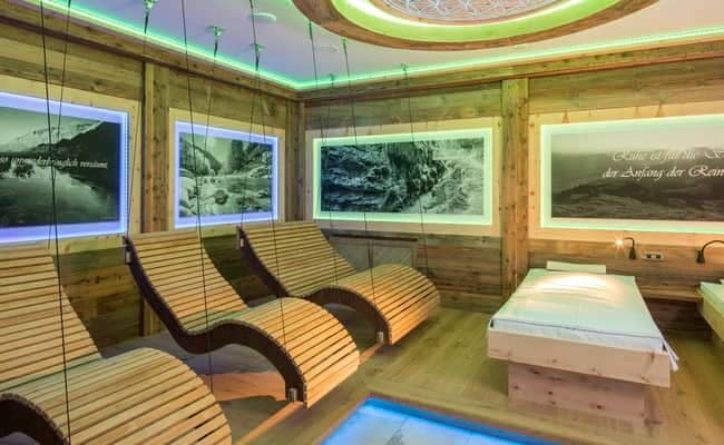 Spa relaxation room with heated ergonomic loungers and ambient lighting