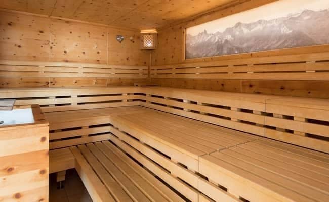 Cedar wood sauna with multi-level seating for 10 guests