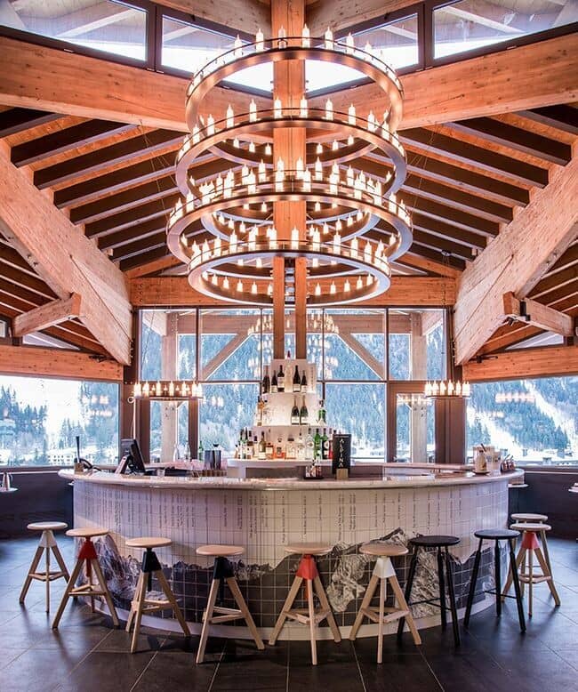 Circular bar with 360-degree mountain views and tiered chandelier