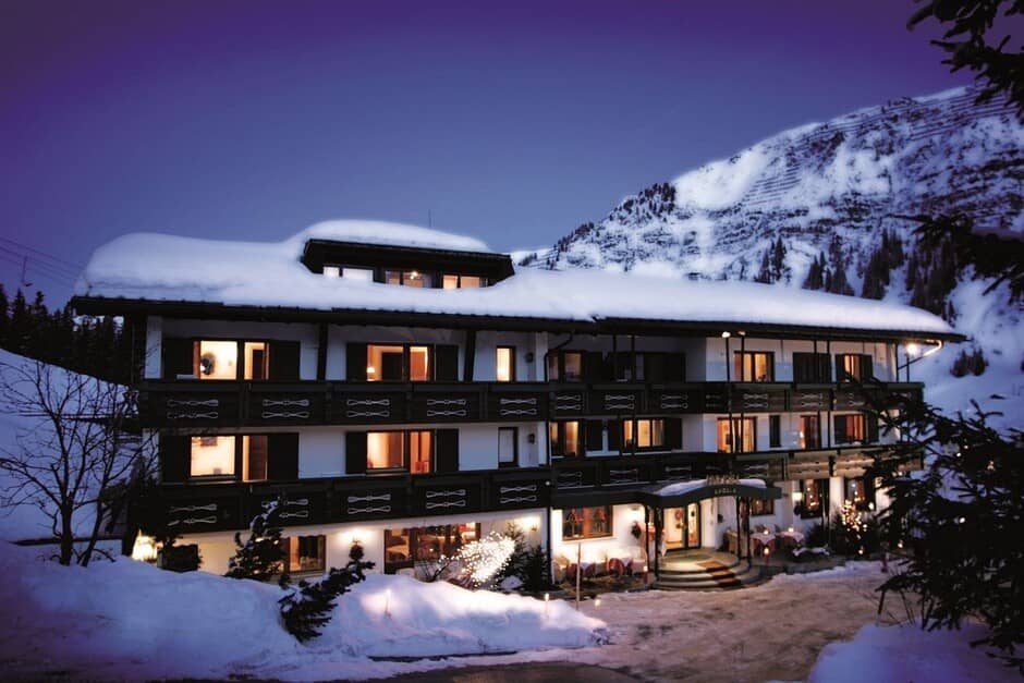 Ski-in/ski-out lodge exterior with private balconies and mountain views