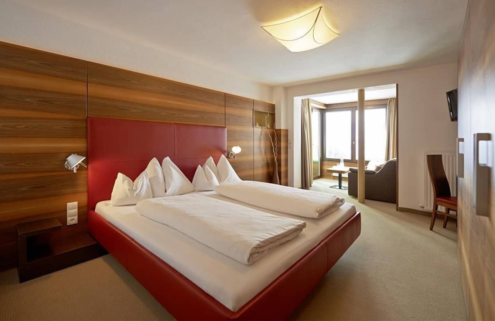 Primary bedroom with king bed and adjoining sitting area