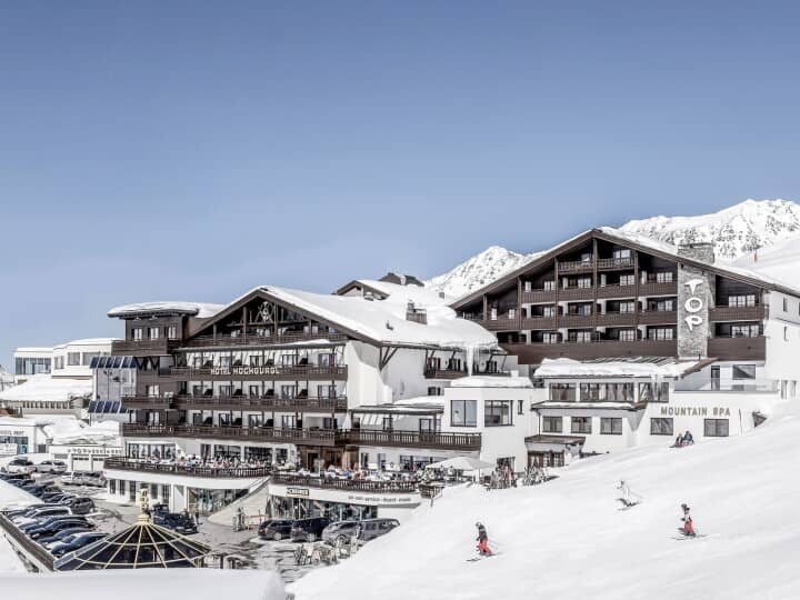 Ski-in/ski-out hotel exterior with on-site mountain spa and sun terrace