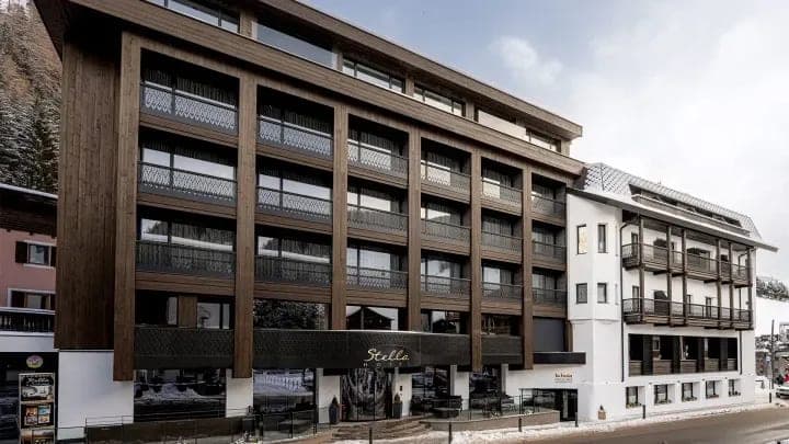 Hotel exterior with private balconies and street-level entrance