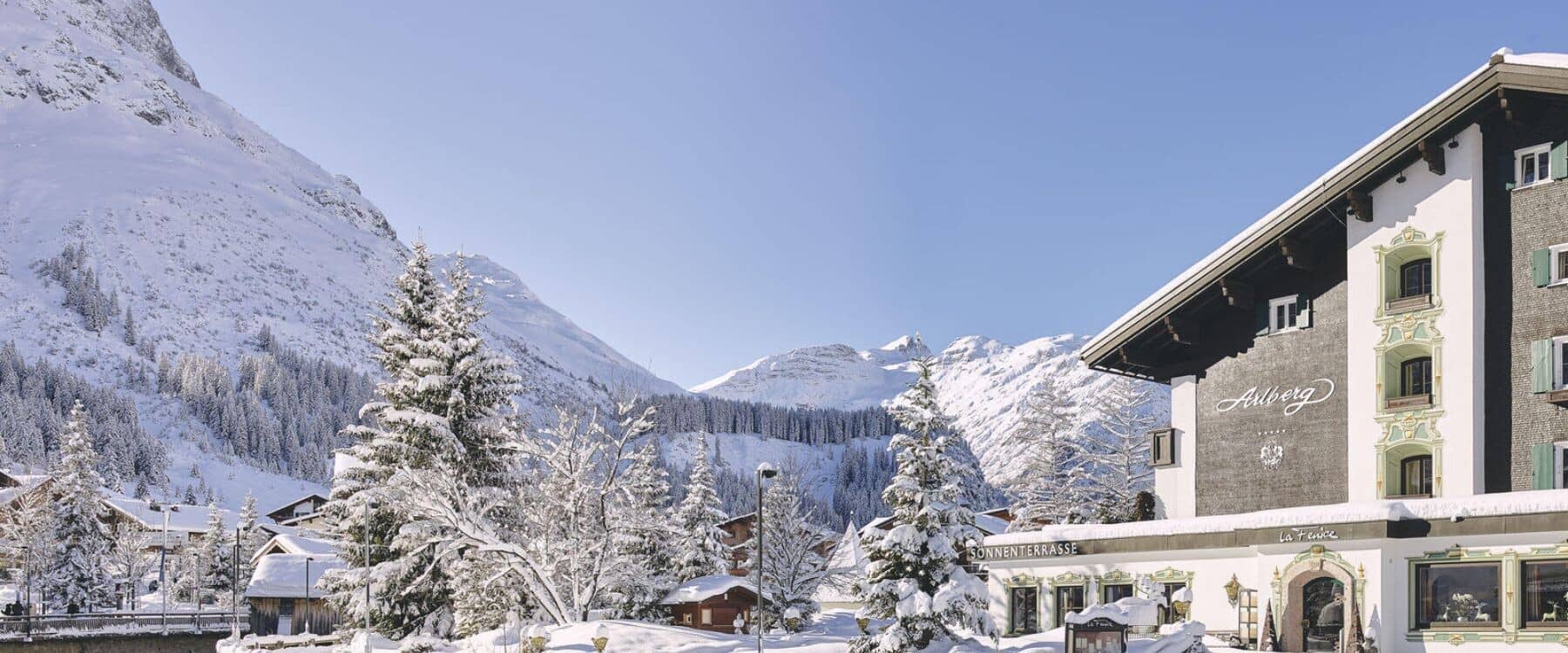 Chalet exterior featuring private balconies and immediate access to alpine hiking trails