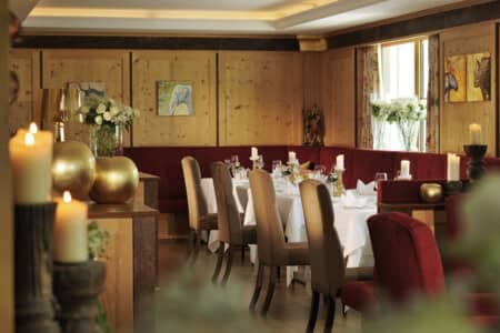 Dining area with booth seating and wood-paneled walls