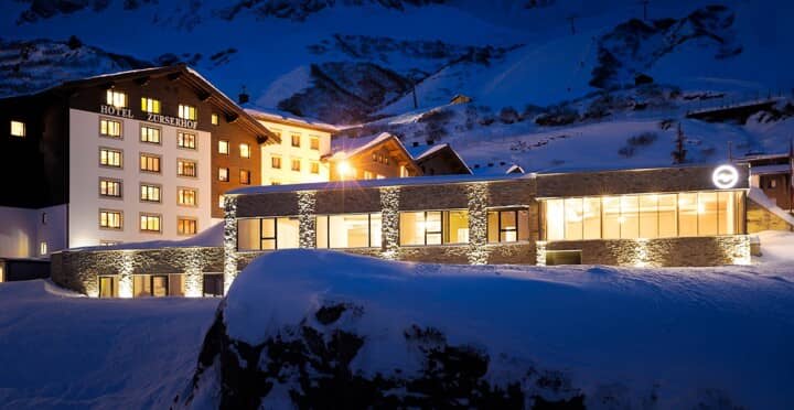 Ski-in, ski-out hotel exterior with direct access to surrounding slopes