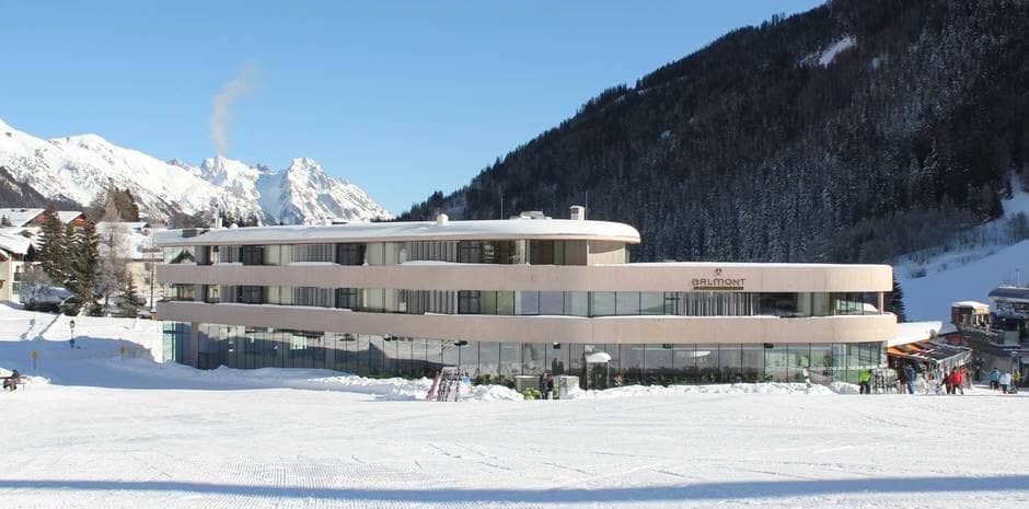 Ski-in/ski-out hotel exterior located directly on the groomed mountain slopes